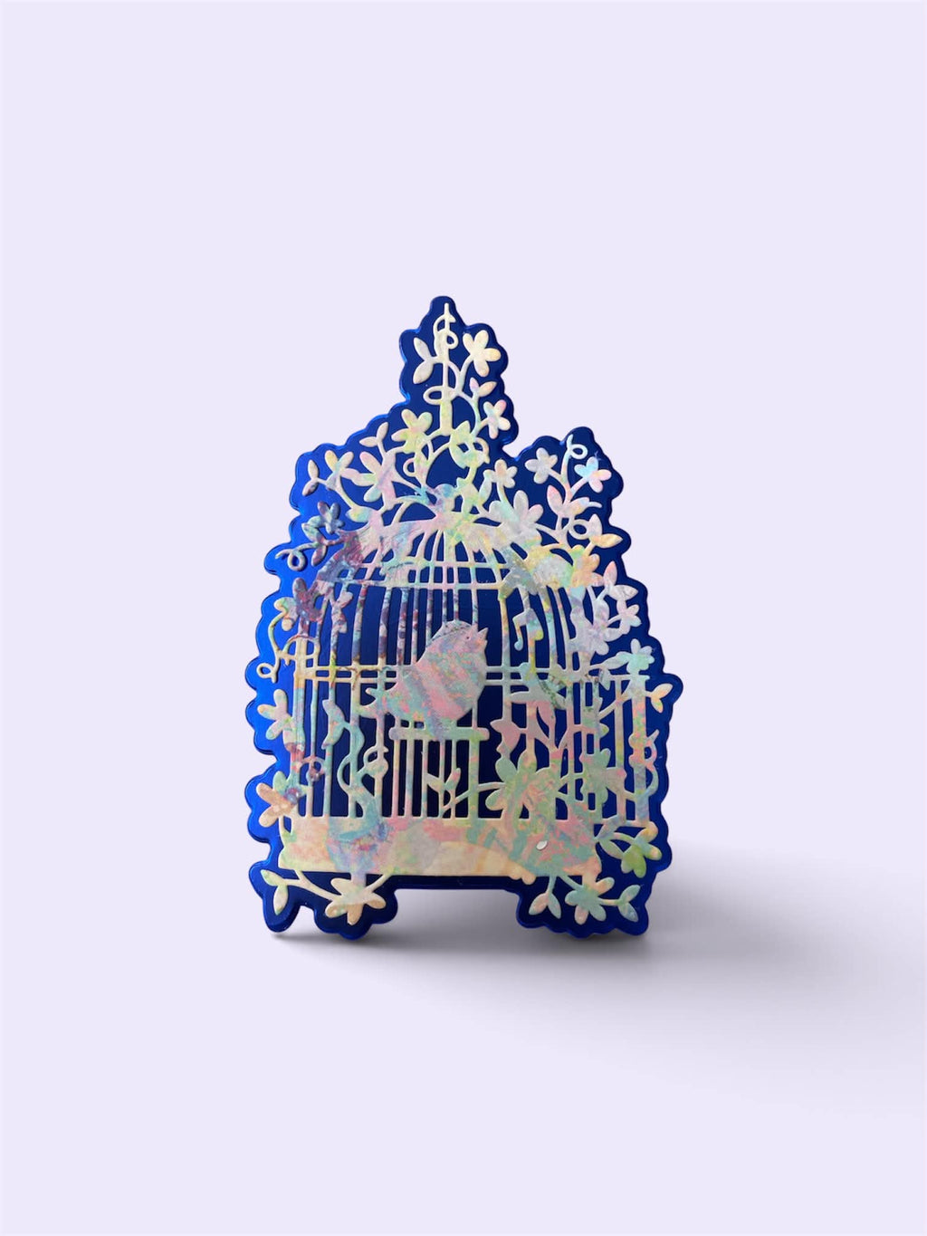 Die cut bird cages on metallic background